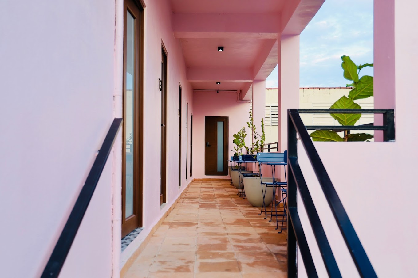 Pink breezeway workspace at Hotel Luz