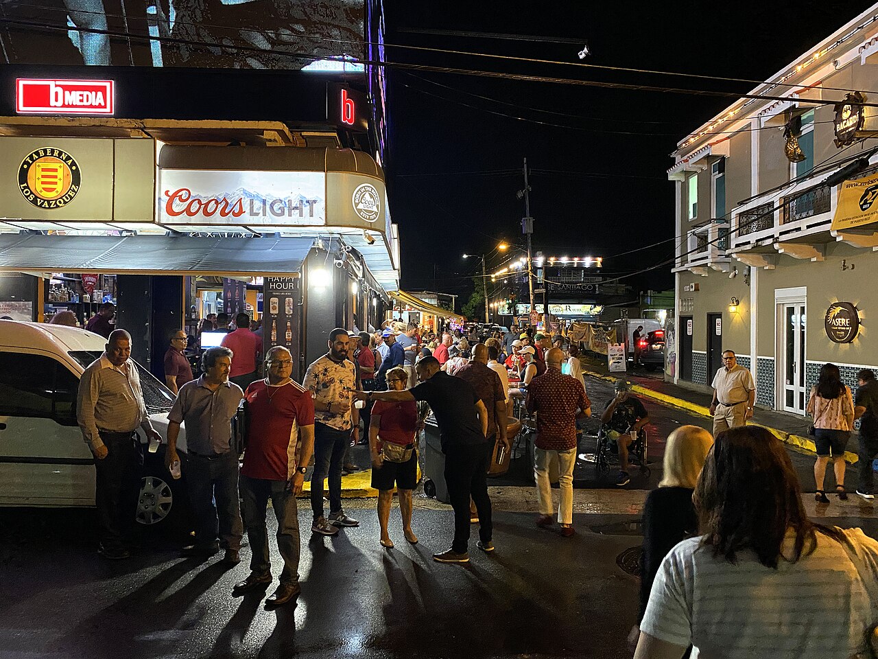 Lively open-air bar and restaurant scene at night in Puerto Rico