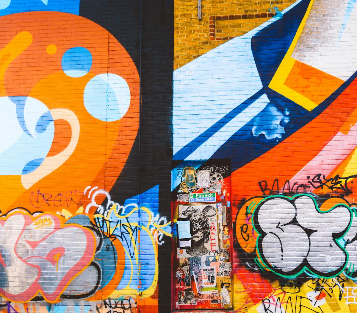 Colorful street art murals on a building wall in Santurce, San Juan